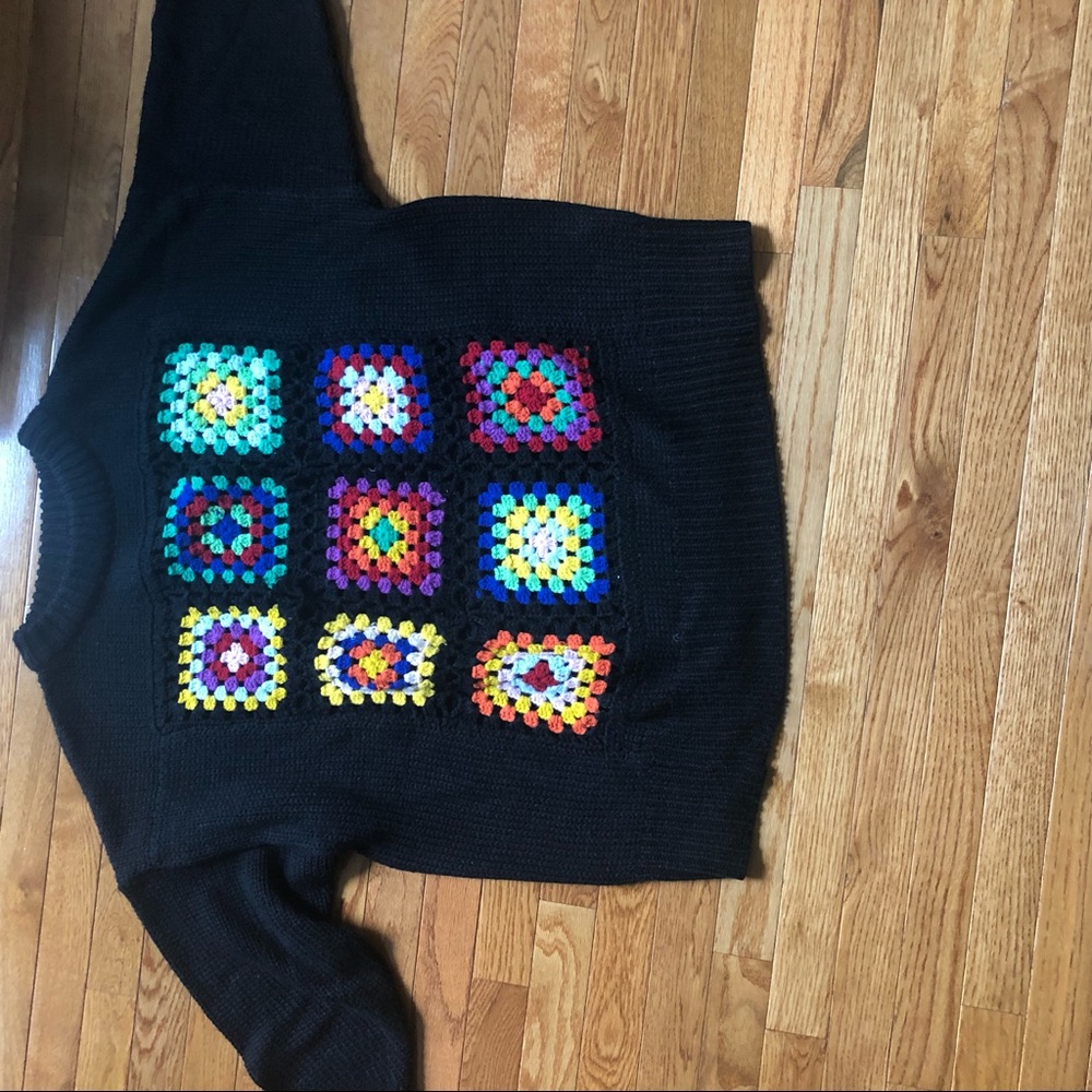Sweater with crocheted patches